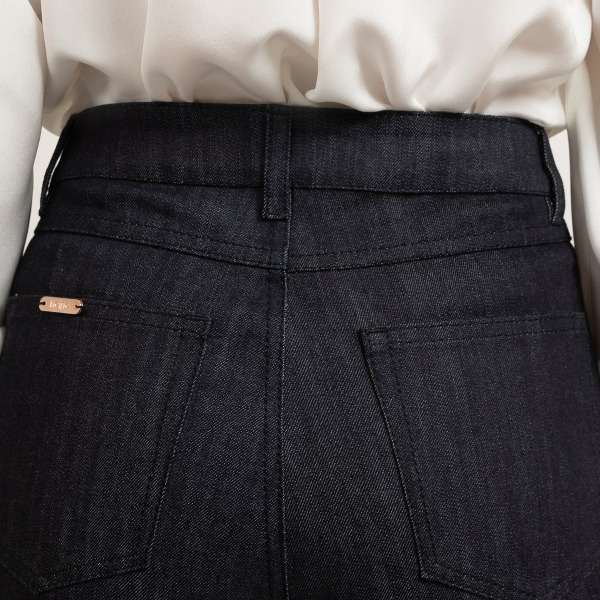 Blue short denim skirt with matching stitch