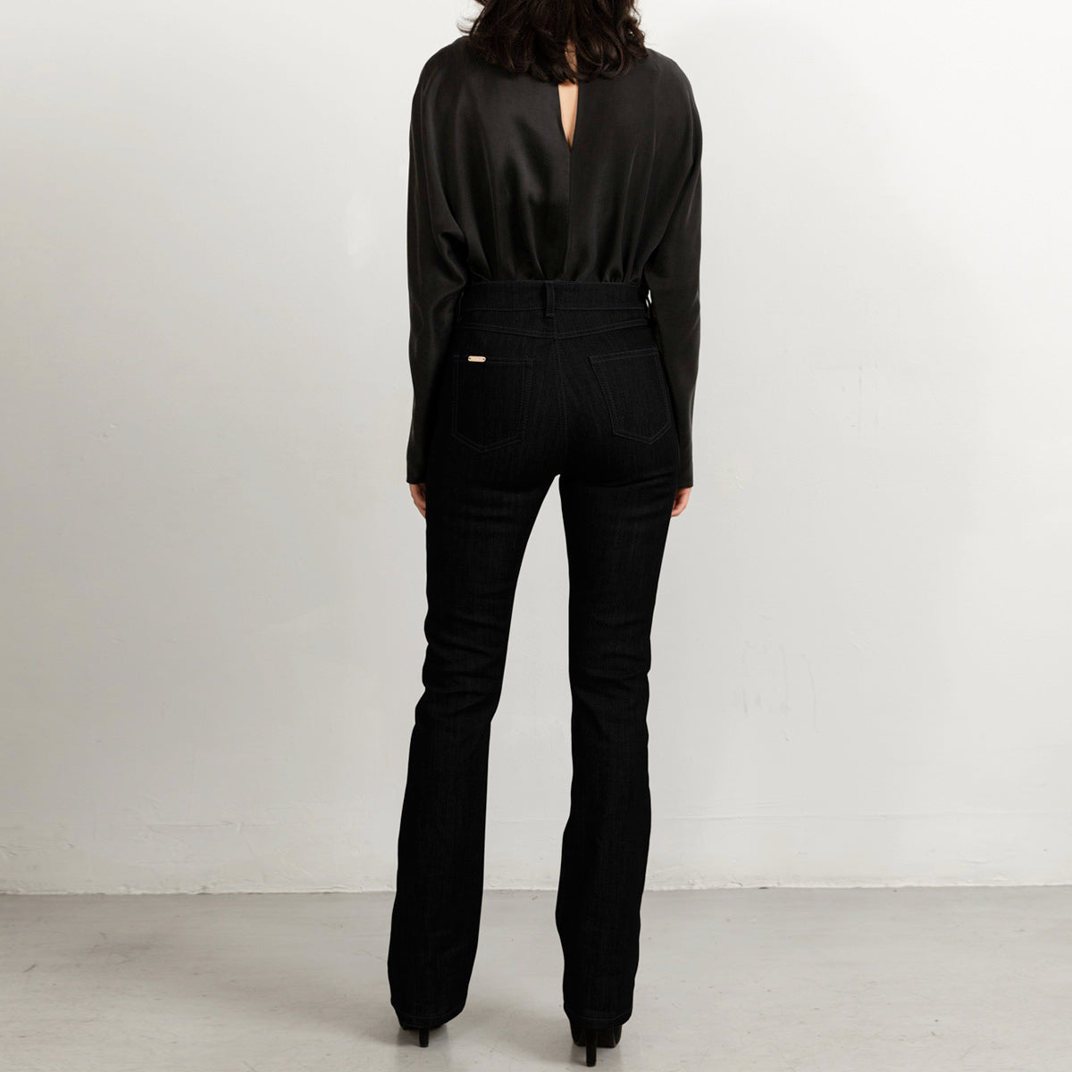 Black flared jeans with matching stitch, long