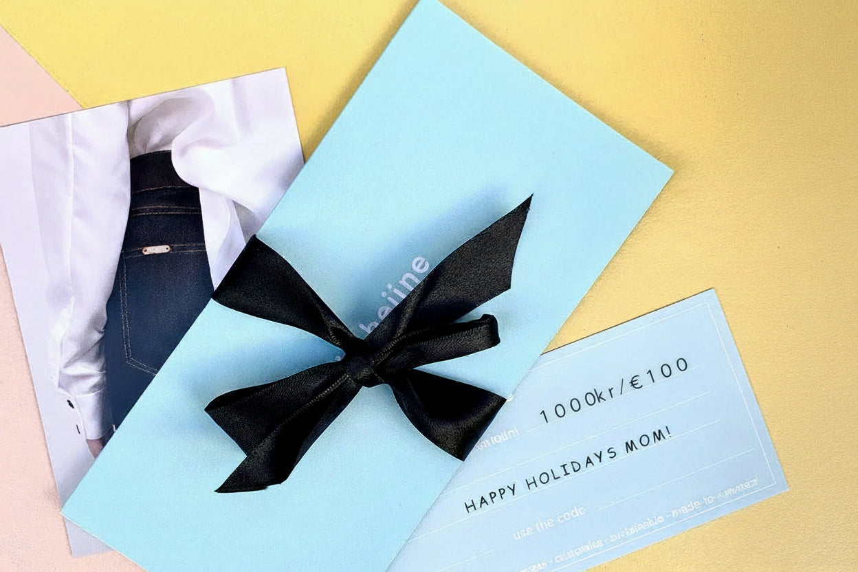 Gift card with black bow in a blue envelope on a colorful background