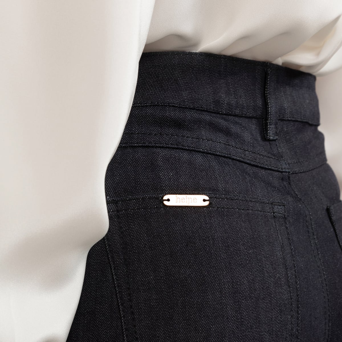 Blue knee length denim skirt with matching stitch