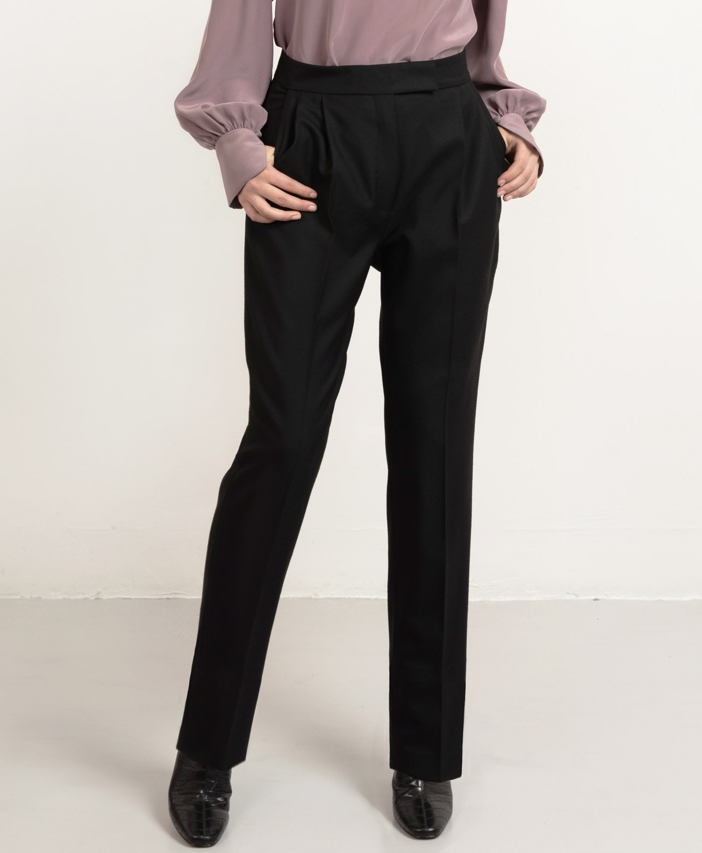 Custom-fit long pleated wool trousers by Studio Heijne