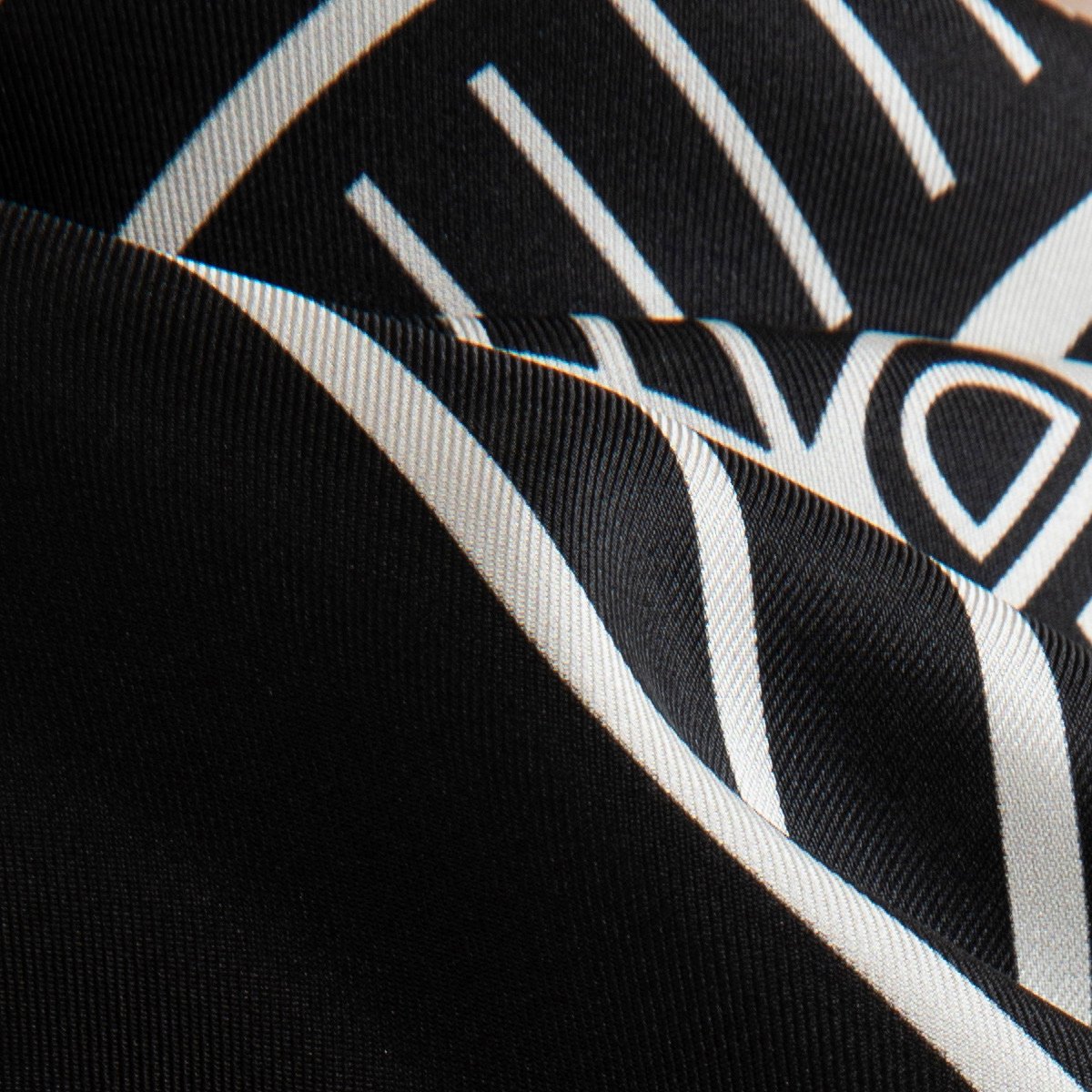 Silk scarf with signature logo print in black by Studio Heijne